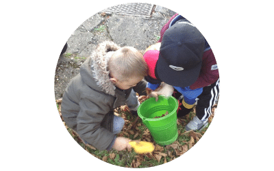 children playing with leaves